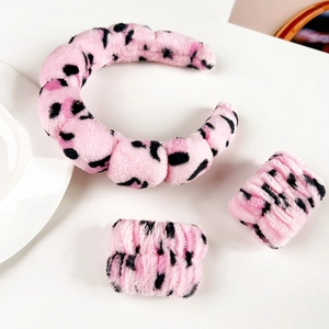 Pink leopard print flannel headband and wristbands set for skincare and makeup routines