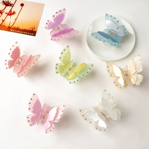 Set of iridescent butterfly hair claws with rhinestones in various pastel colors