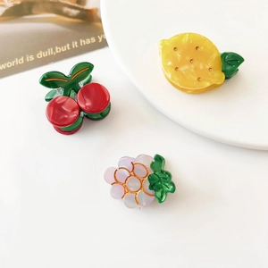 Set of 3 cartoon acetate fruit hair claws featuring cherry, lemon and grape shapes