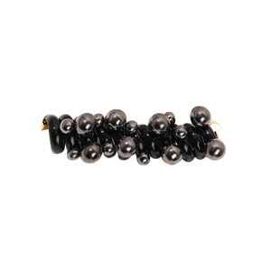 Spiral telephone wire hair tie with black metallic beads on a clean white background