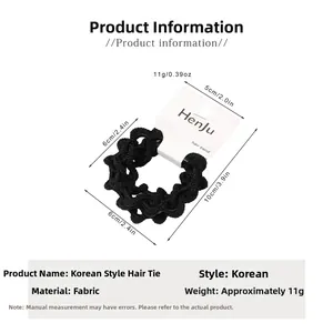 Detailed view of elastic coffee-colored hair tie on HenJu brand card packaging