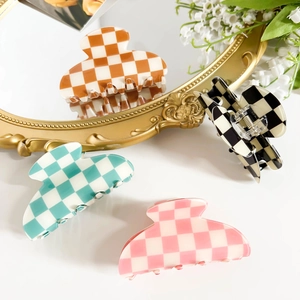 Set of four checkerboard pattern semicircular hair claws in vibrant multi-color options