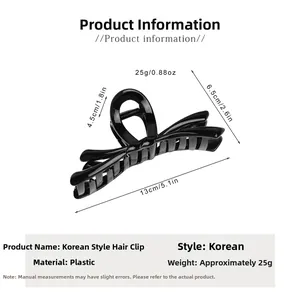 Détail de la pince à cheveux nœud noir avec dimensions de 13cm x 6,5cm
