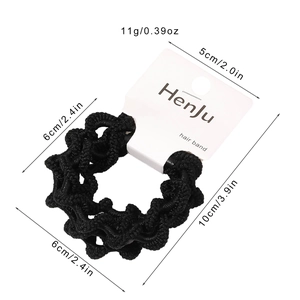 Elastic black hair tie set with 6cm diameter and 11g weight on a branded card