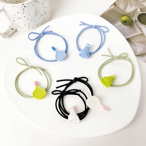 Detailed view of badminton and tennis racket charms on colorful high-elastic hair ties