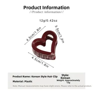 Detail of red heart-shaped hair claw clip with measurements 4.5cm and 12g weight