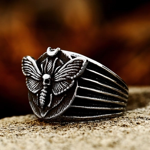 Vintage stainless steel skull moth ring for men with antique silver finish and punk aesthetic