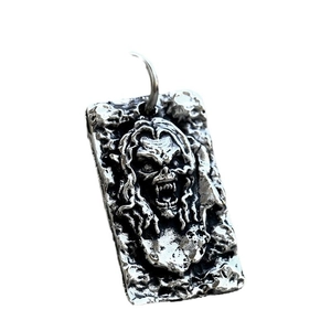 Vintage stainless steel rectangular pendant featuring a gothic skull relief with antique finish