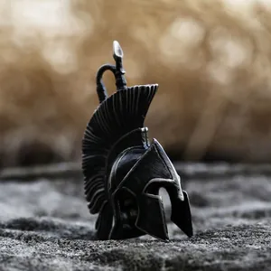 Retro stainless steel Spartan warrior helmet pendant on natural stone background