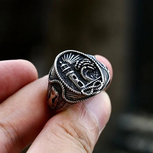 Detailed macro view of vintage lighthouse engraving on stainless steel signet ring