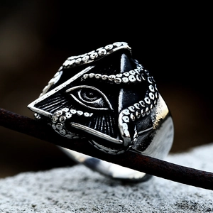 Detailed macro view of the evil eye and octopus tentacle design on the vintage steel ring