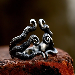 Vintage octopus tentacle ring in oxidized stainless steel with punk style sucker details
