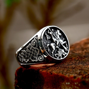 Vintage stainless steel ring with relief of Saint George slaying the dragon