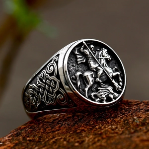 Vintage stainless steel ring featuring St. George killing the dragon relief and Celtic knots