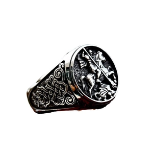Vintage stainless steel ring featuring St. George dragon relief and Celtic knot patterns