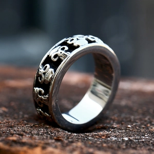 Macro shot of punk style stainless steel skull ring with vintage embossed details