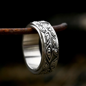 Vintage stainless steel spinner ring with evil eye carvings and gothic silver finish