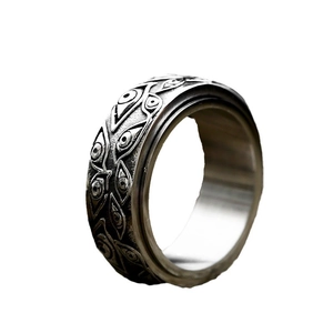 Retro stainless steel spinner ring featuring gothic evil eye relief patterns for men