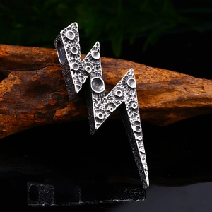 Vintage lightning bolt pendant in silver stainless steel with rock texture finish