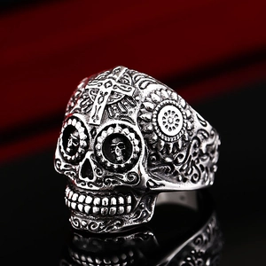 Vintage stainless steel skull ring featuring engraved cross and floral gothic motifs