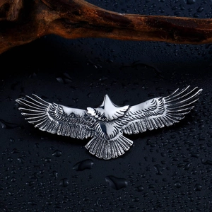 Vintage stainless steel soaring eagle pendant with detailed silver feather carvings