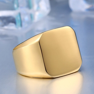 Close-up of a matte gold square signet ring displayed on ice cubes for a sleek look