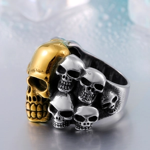 Bague punk gothique en acier inoxydable avec crâne doré et crânes argentés superposés