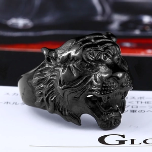 Macro shot of detailed black stainless steel tiger head ring with vintage punk carvings