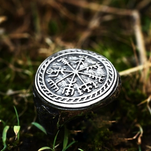 Vintage Viking compass signet ring in antique silver finish on natural mossy background