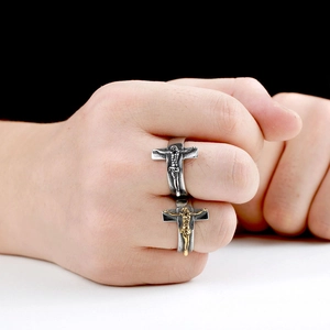 Detailed close-up of retro stainless steel crucifix rings with vintage silver and gold finish