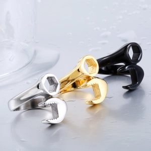 Industrial style stainless steel wrench rings in silver, gold, and black finishes