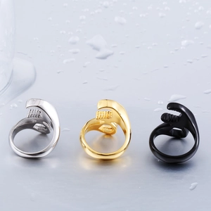 Detailed view of wrench-shaped industrial rings in silver, gold, and black finishes