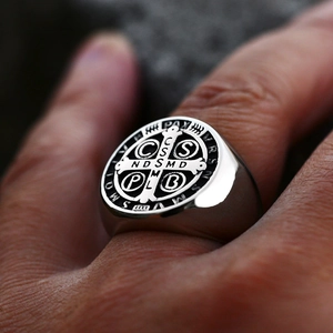 Macro detail of men's Saint Benedict medal ring in vintage solid stainless steel