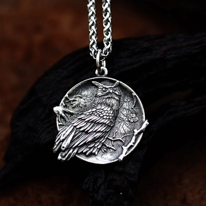 Macro detail of vintage owl relief pendant in distressed finish with intricate texture