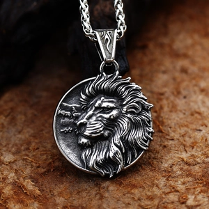Macro shot of silver stainless steel lion head pendant with intricate mane texture