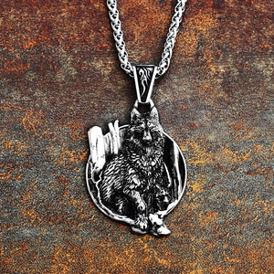Close-up of vintage stainless steel wolf head relief pendant on industrial rusty background