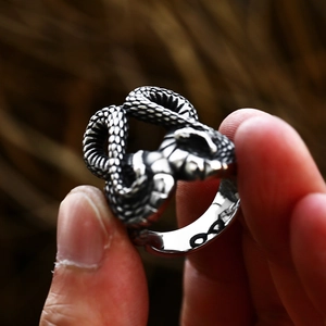 Detailed macro view of vintage silver snake ring with textured scales and gothic design