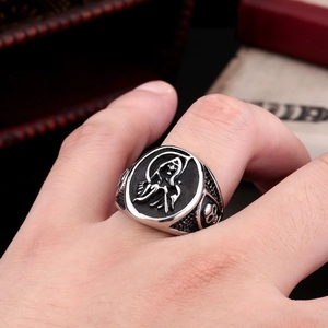 Gothic stainless steel Grim Reaper ring with skull patterns and a vintage black finish