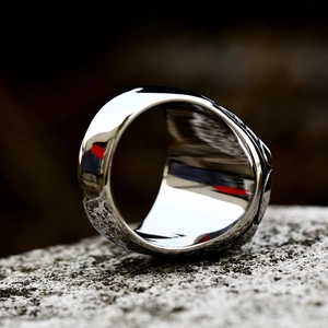 Macro shot of polished inner surface and detailed relief texture on a heavy silver steel ring