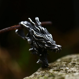 Vintage stainless steel dragon head pendant with detailed scales and silver finish