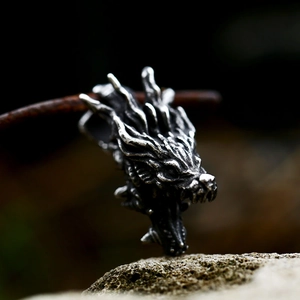 Macro view of vintage stainless steel dragon head pendant with oxidized silver finish