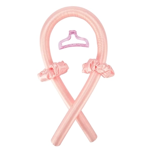 Detailed view of pink silk heatless hair curler set with scrunchies and claw clip