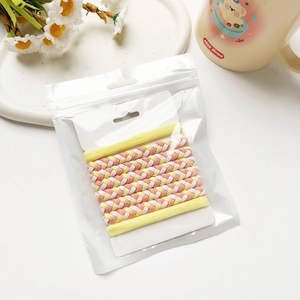 Élastiques à cheveux tressés roses et jaunes, emballés dans un sac transparent avec crochet