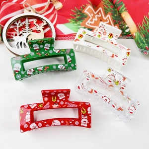 Lot de quatre pinces à cheveux de Noël avec motifs de Père Noël et de flocons de neige