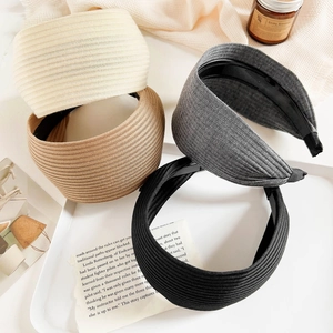 Close-up of wide knitted headbands in four colors with non-slip inner teeth detail