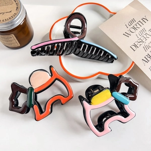 Three acrylic hair claws featuring cat silhouettes and colorful dopamine styles