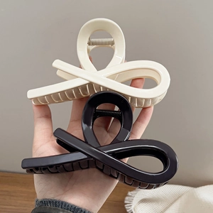 Set of large black and cream hollow hair claw clips for women with thick hair