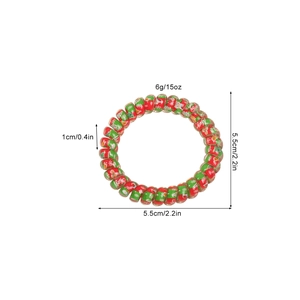 Christmas spiral hair tie with red and green holiday patterns and 5.5cm size details