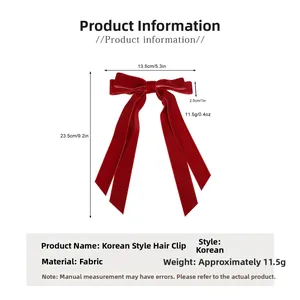 Détail du nœud à cheveux en velours rouge dimensions 13,5 cm de large et 23,5 cm