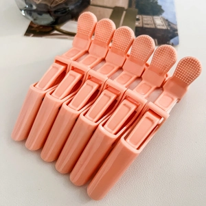 Set of 6 coral pink matte hair clips with non-slip texture for hair styling